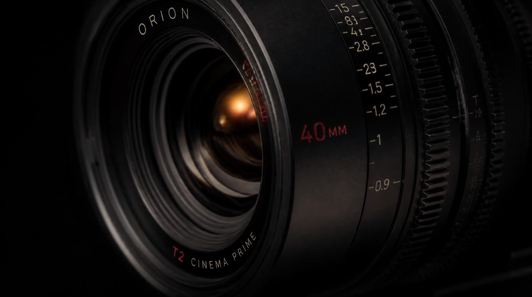Extreme macro of a cinema prime lens catching a warm highlight